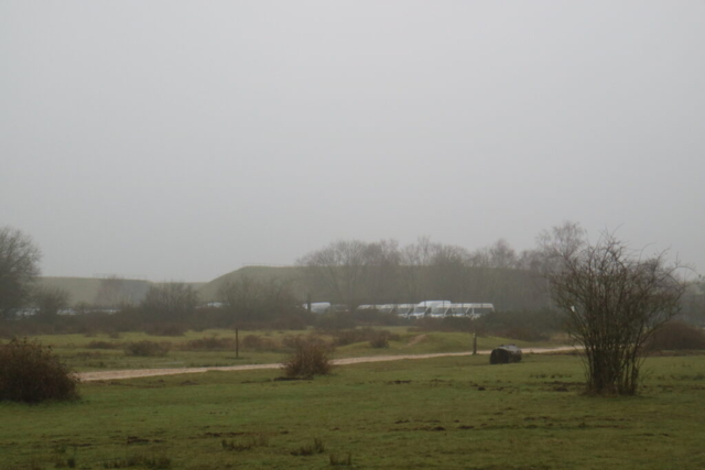 view of the missile silo bunkers remaining behind a fence