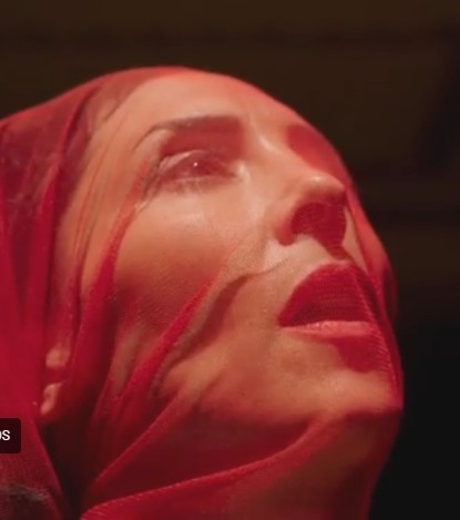 gazelle twin in a red veil